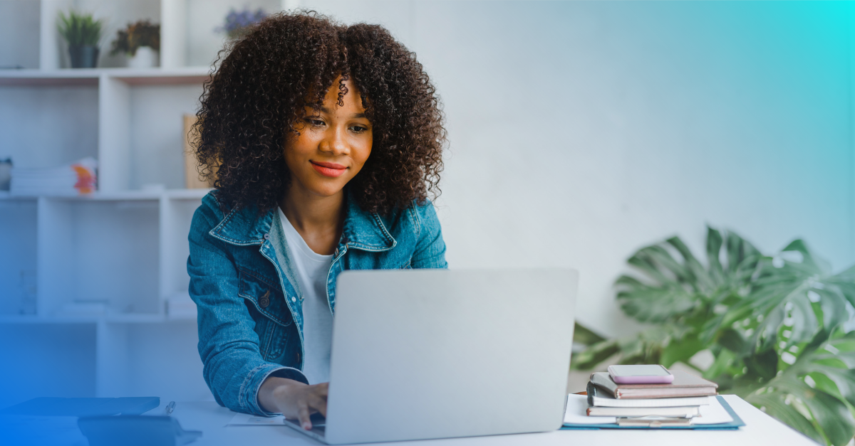 Young woman sitting at a laptop computer. 